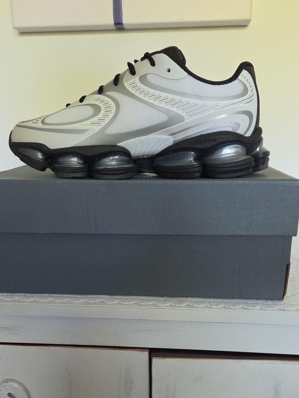 New Balance Unisex Athletic Shoe in Silver and Black